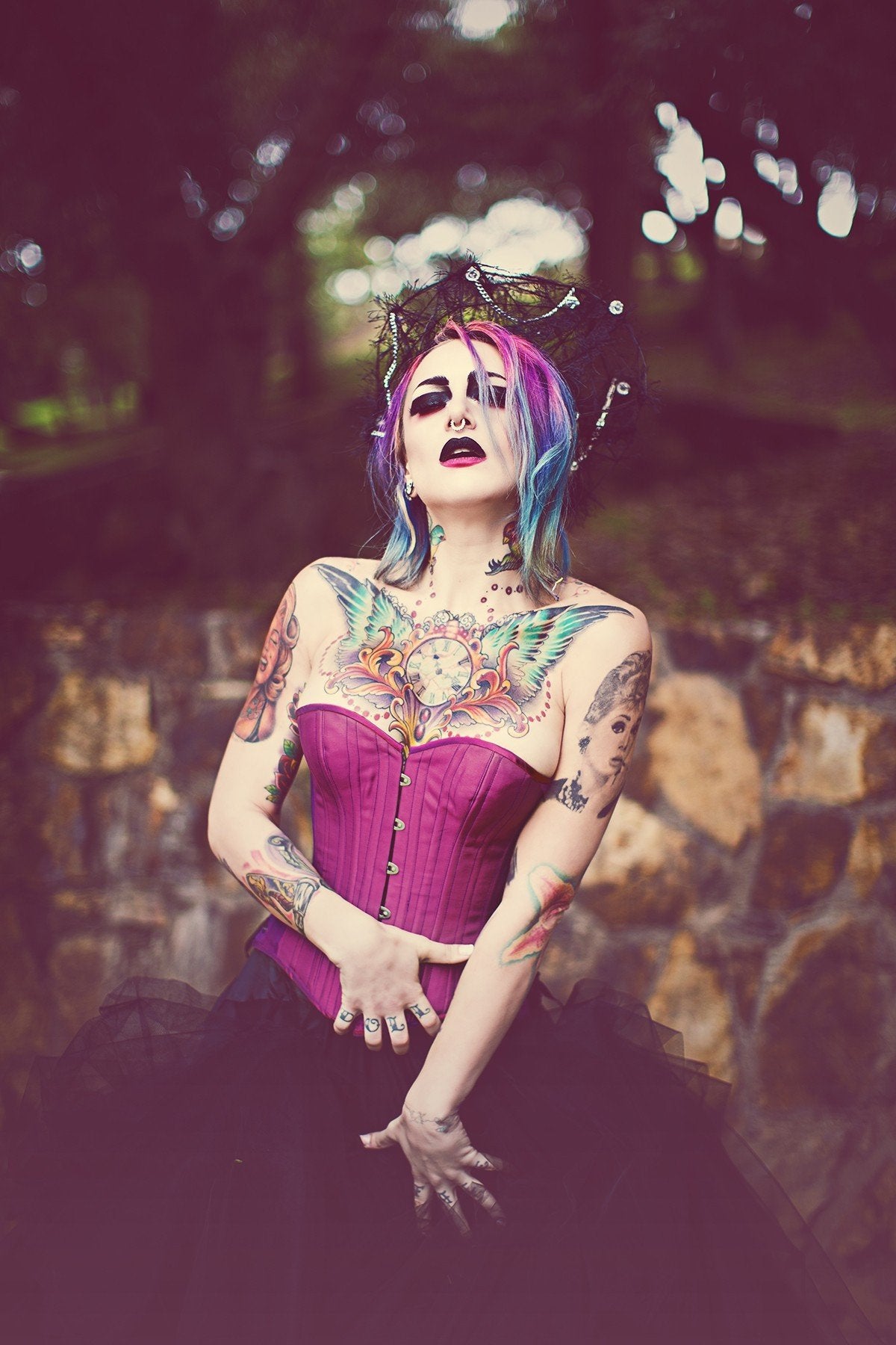 Iridescent Purple Taffeta Corset, slim silhouette, sweetheart overbust with adjustable side hip lacing, on a model wearing a full black tulle skirt, standing out in nature