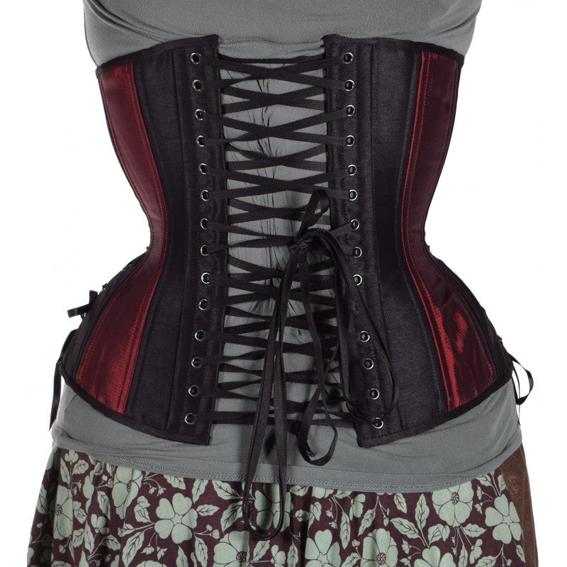 Iridescent red taffeta corset with insert panels of black taffeta, hourglass silhouette, long length with adjustable side hip lacing, back view with black flat shoe lacing 