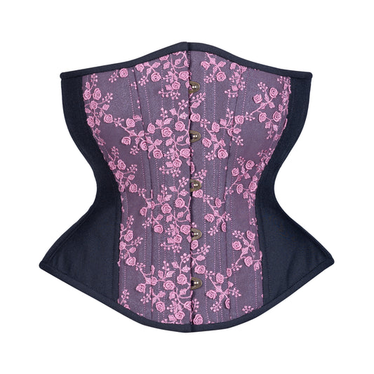 Black Berry Rose, a corset with dusty pink rosebud lace over the front of a black textured peau de soie, hourglass silhouette, regular underbust length, front view with busk closure